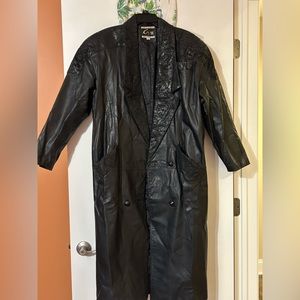 Black leather trenchcoat with design on lapel and shoulders